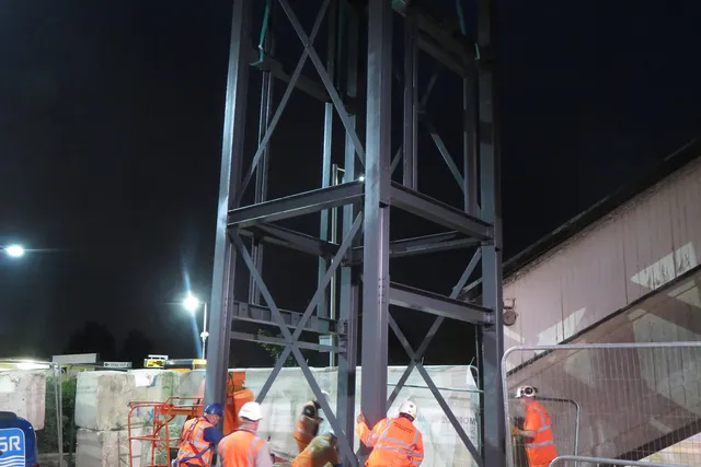 MSR erection crew installing a steel tower frame during a night shift